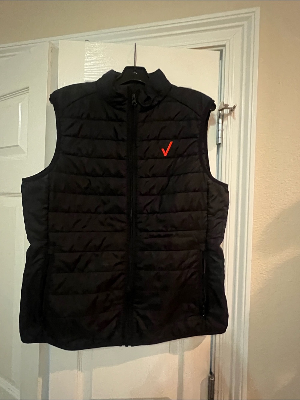 Verizon Employee Black Quilted Vest with Red Check Logo